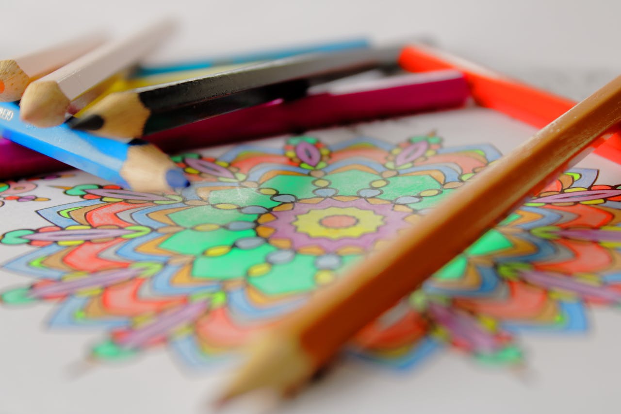 Vibrant mandala coloring with colored pencils, showcasing creativity and art.